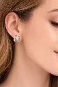 Elegant gold earring with blue gemstone.webp