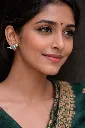 Serene close-up with antique silver earrings.webp