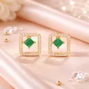 Emerald and diamond halo earrings